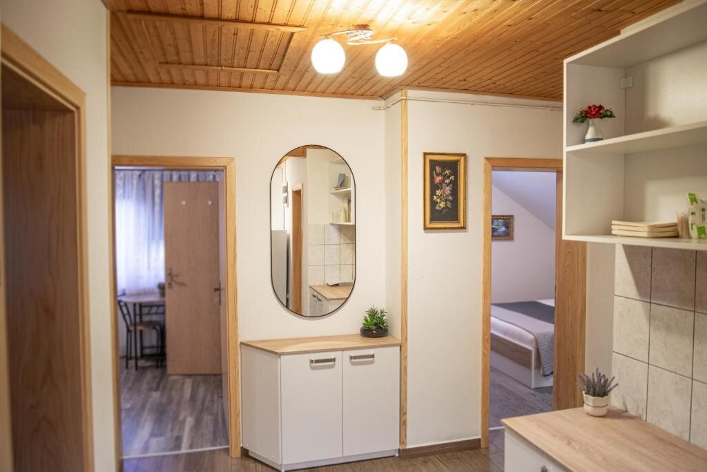 Rustic interior with wooden ceiling at Rooms Ruza
